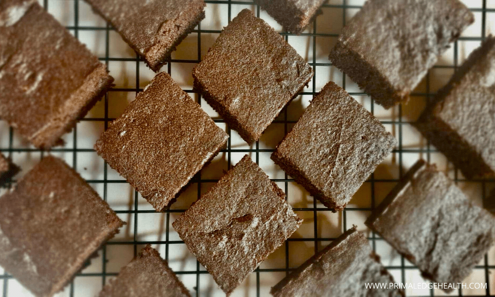 Flourless keto brownies in a cooling rack.
