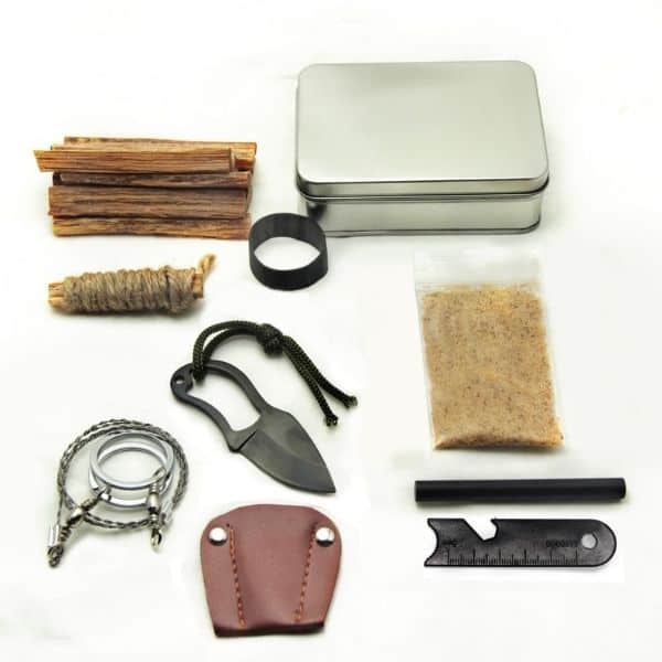 A survival kit laid on a white background.
