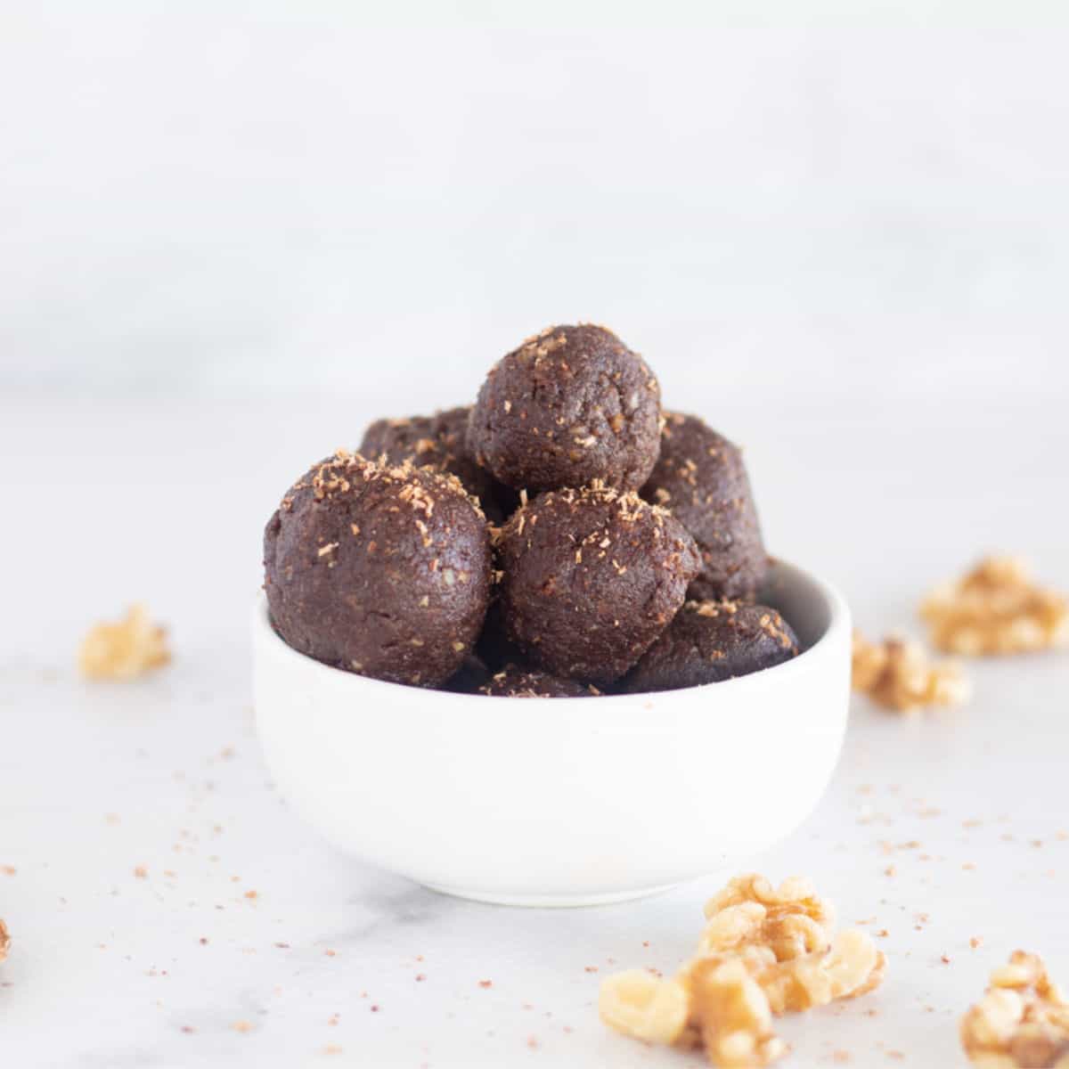 Keto brownie bites in white bowl.