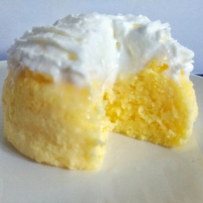 Keto lemon cake square with a bite.
