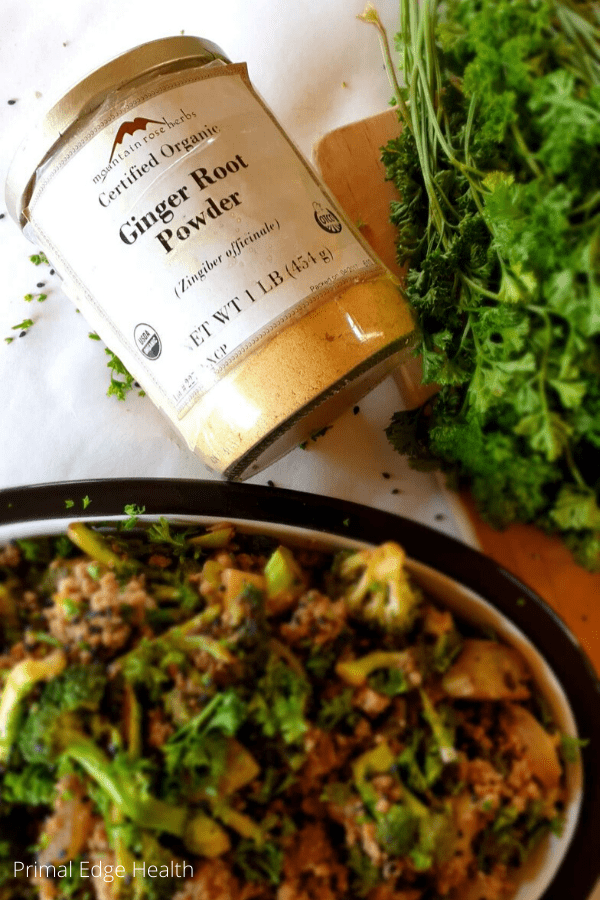 Keto ground beef broccoli next to a jar of ginger root powder.