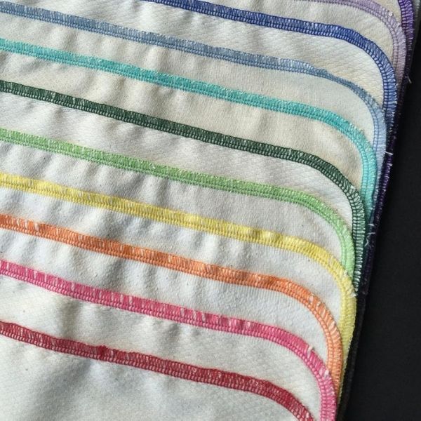 A stack of reusable paper towels with different colors.