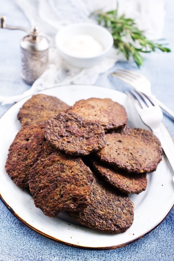 A plate with beef liver patties and a fork, perfect for those following a carnivore diet.