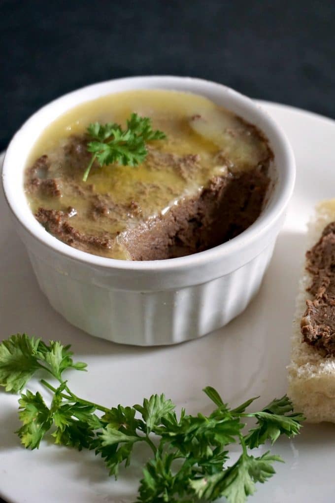 A plate of easy liver pate with bread on the side.