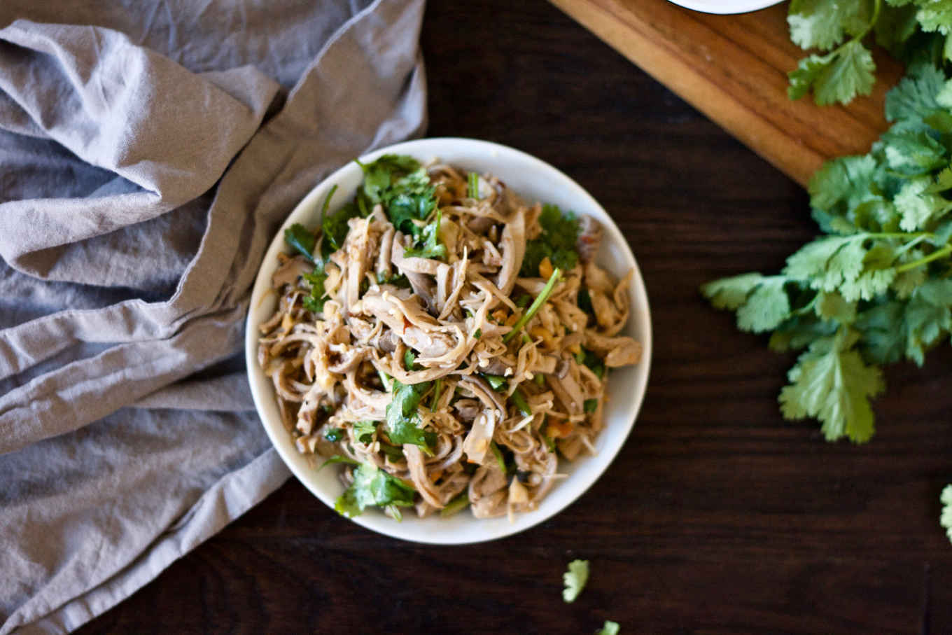 Spicy Szechuan tripe salad in a white bowl.