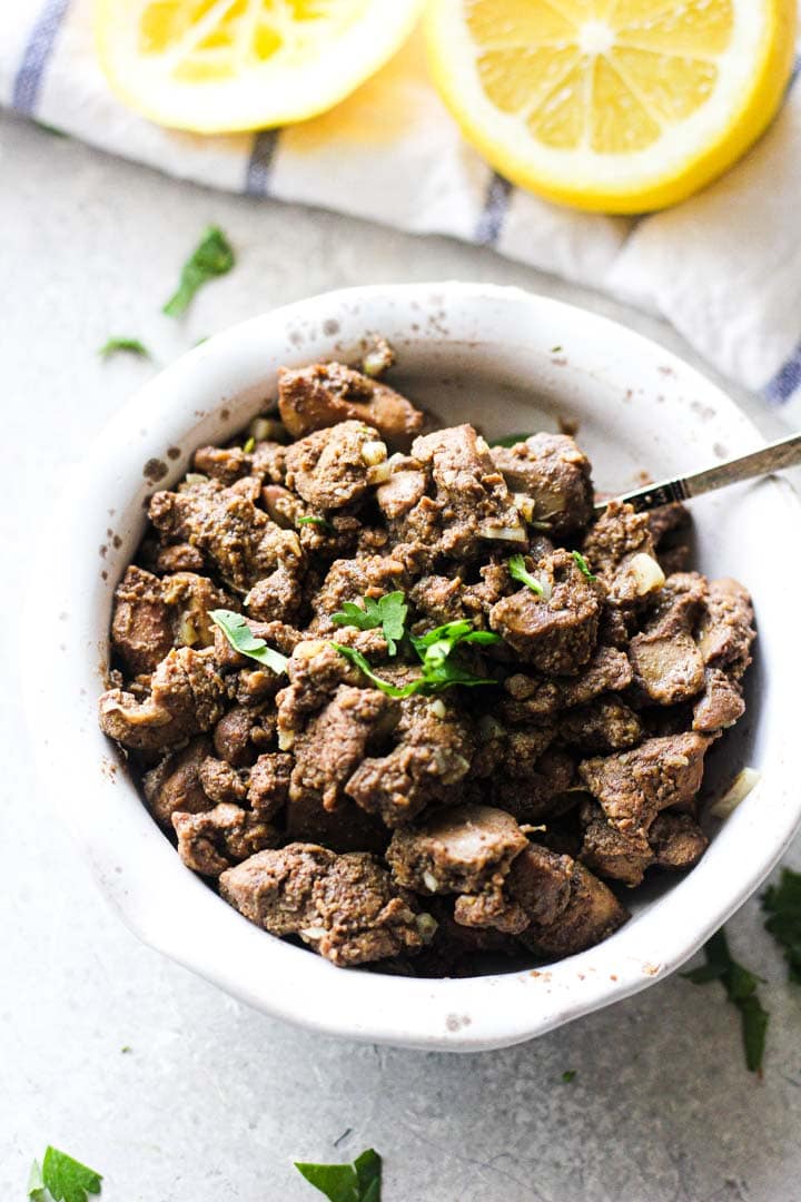Chicken liver recipe in a white bowl.