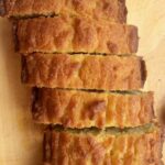 Slices of keto sandwich bread on a light wooden surface.