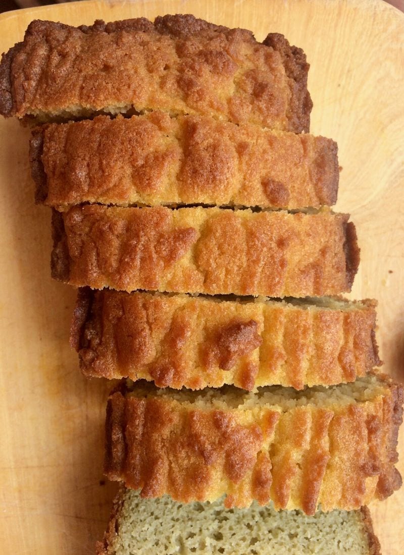 Slices of keto sandwich bread on a light wooden surface.