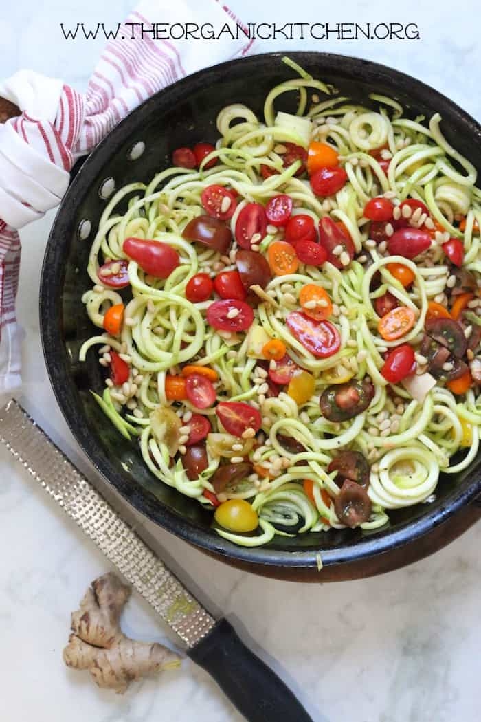 Vegan keto zoodle recipe ready to serve in a black bowl.