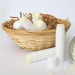 Tallow lip balms in a wicker basket.