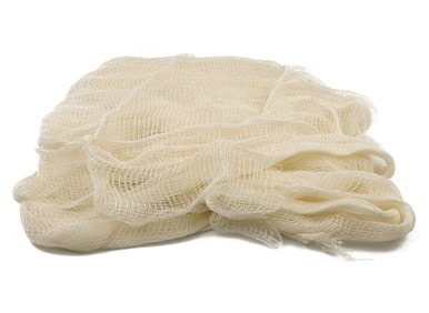 Cheese cloth in a white surface.