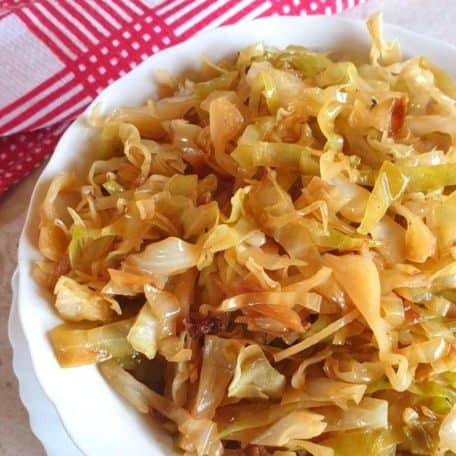 Braised cabbage in a white bowl ready to be served.