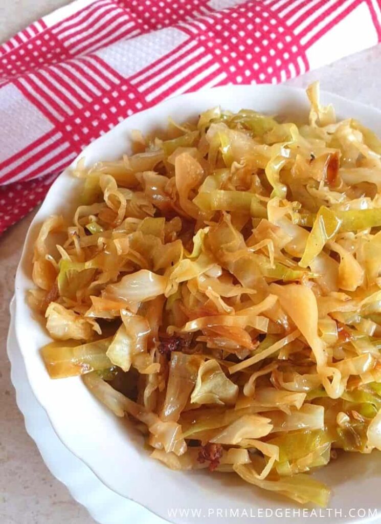 Braised cabbage in a white bowl ready to be served.