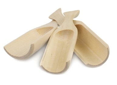 3 wooden spoons in a white surface.