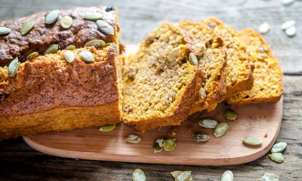 Pumpkin bread on a wooden board.