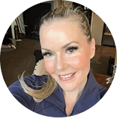 A picture of a blonde woman smiling.