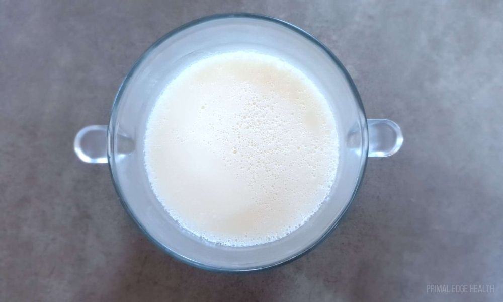 White liquid in a clear container.