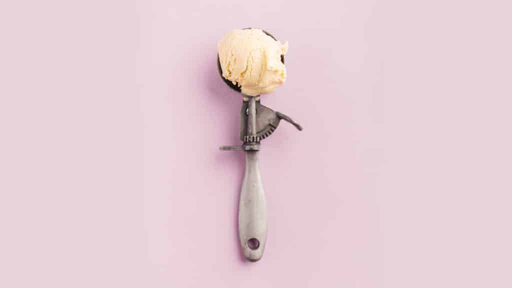 A scoop of ice cream in a purple background.