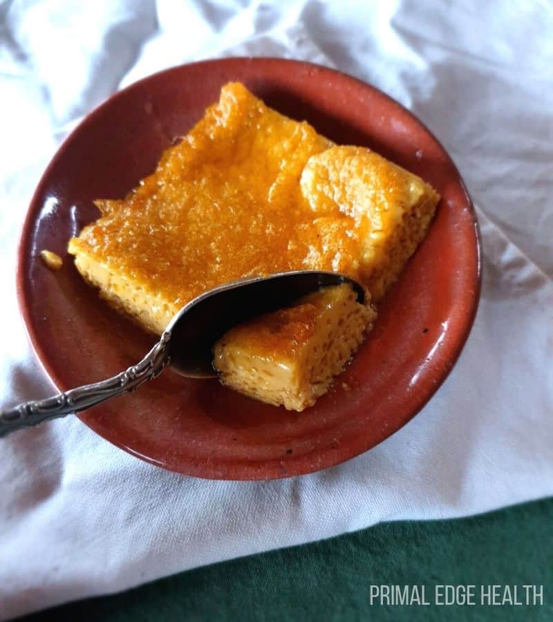 A serving of carnivore cake with a spoon and a white cloth.