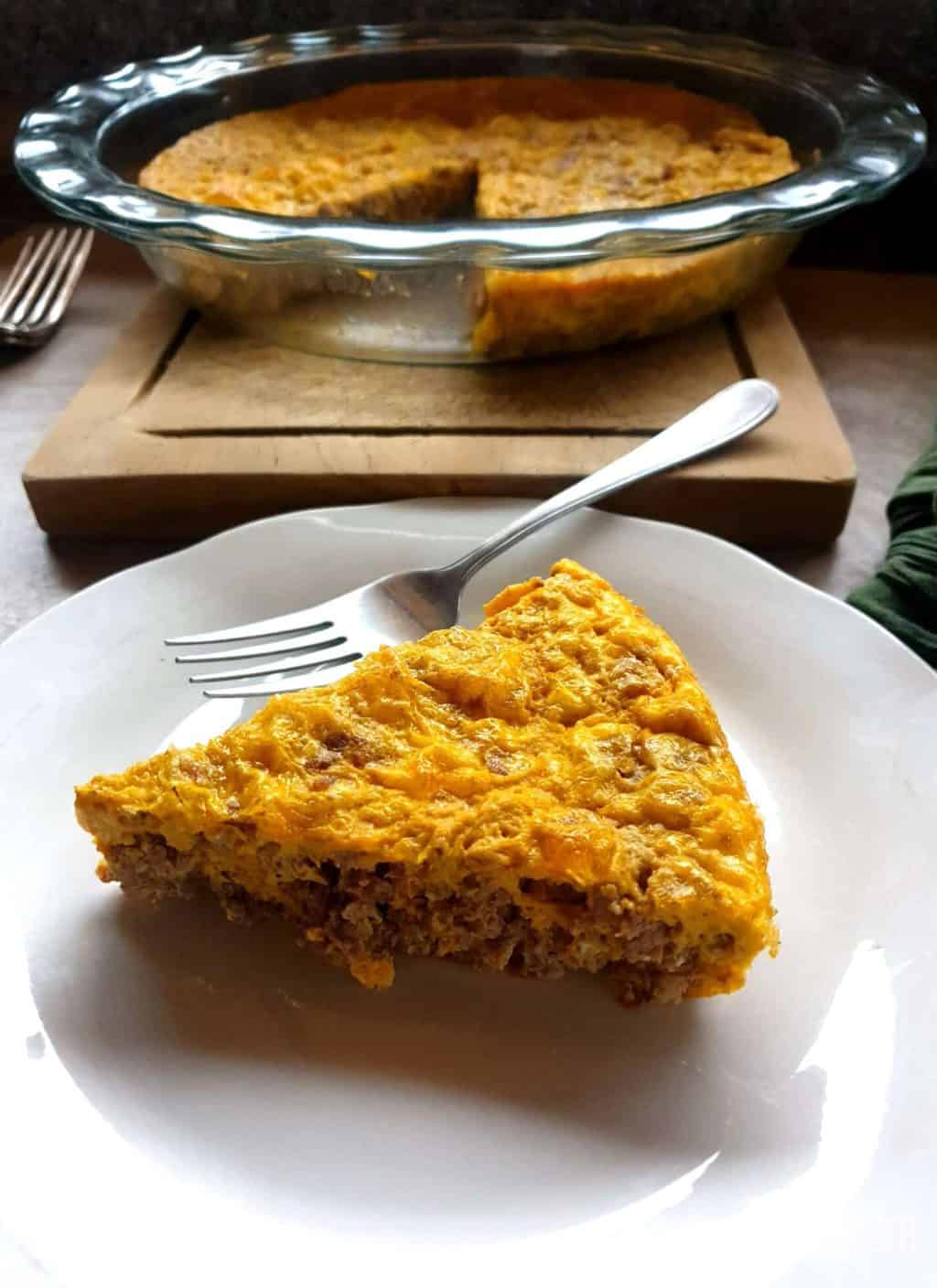 A single slice of carnivore casserole on a white plate.