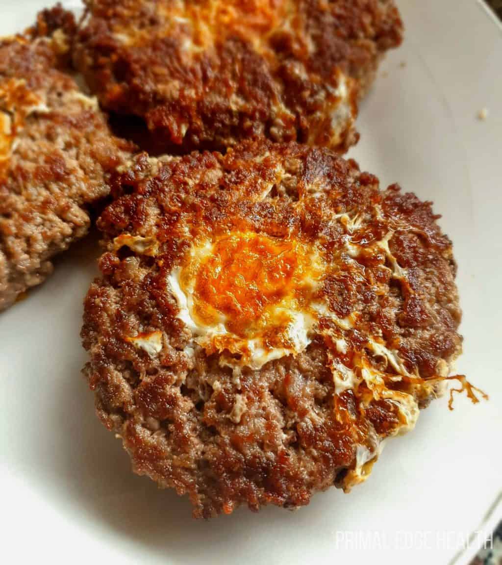 3 pieces of carnivore egg in a hole on a white plate.