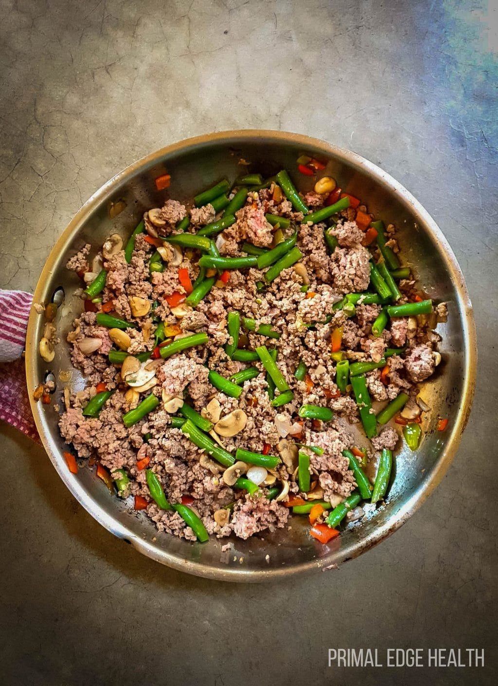 Keto Ground Beef Stir Fry in a pan on a grey surface.