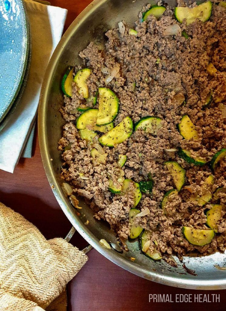 Ground beef veggie skillet on a wooden surface.