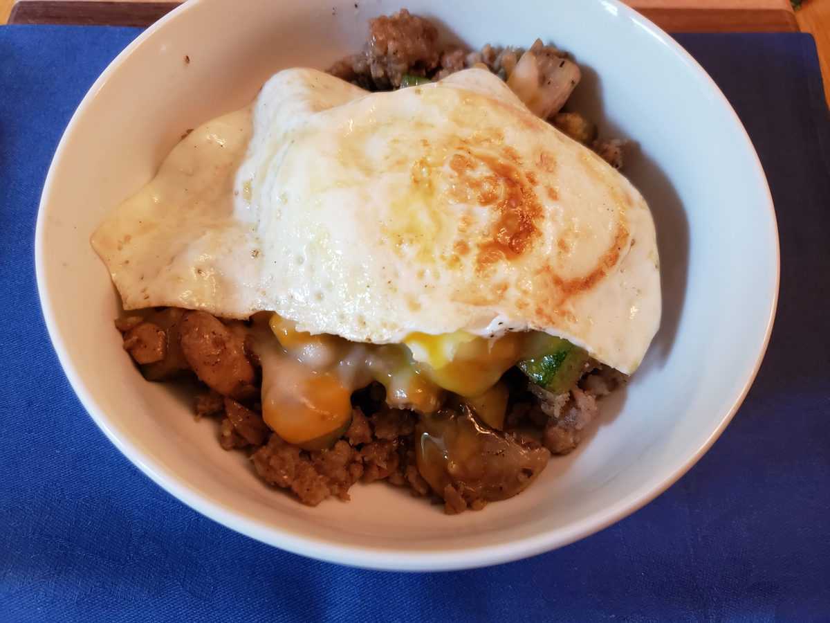 A meat recipe in a white bowl.