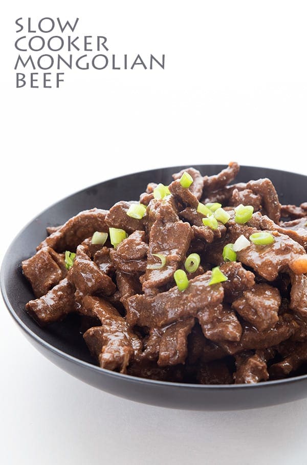 Slow cooker mongolian beef on a white plate.