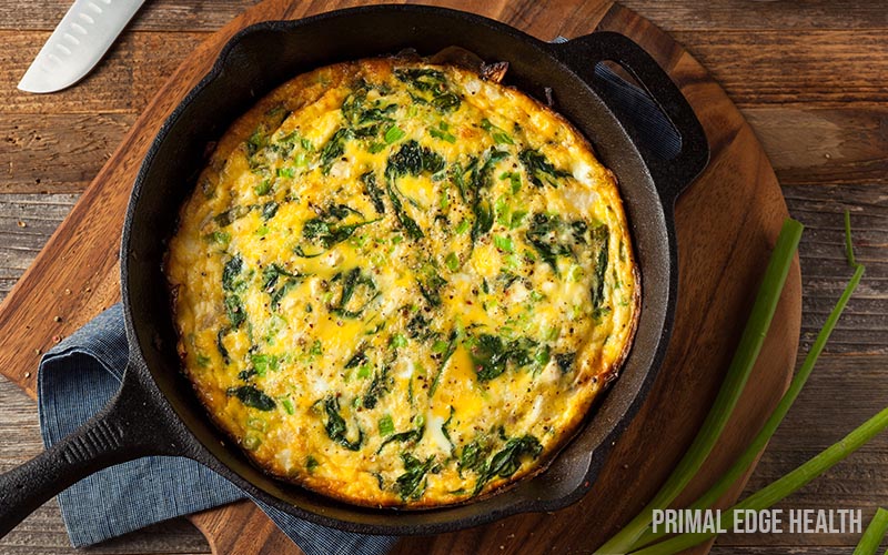 A pot of easy keto frittata on a wooden surface.