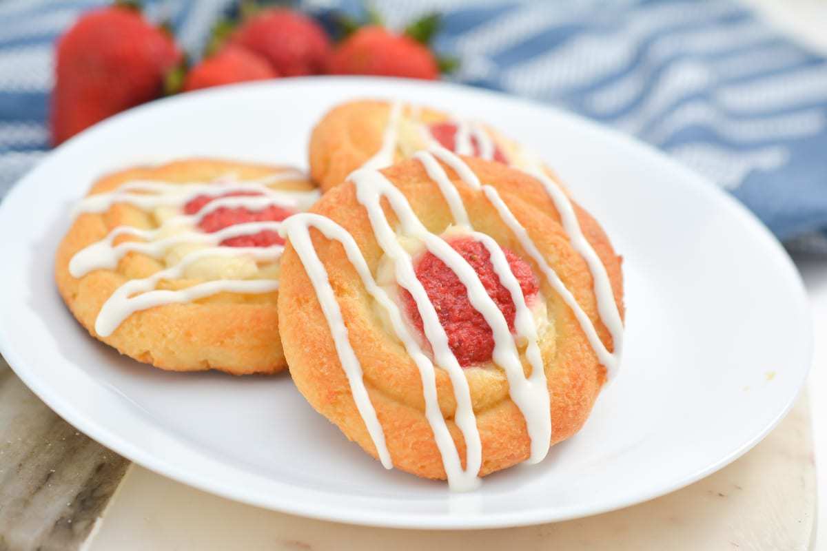 Strawberry cheese keto danish on a white plate.