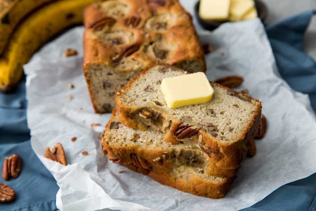 Bread with a slice of butter on top of it.