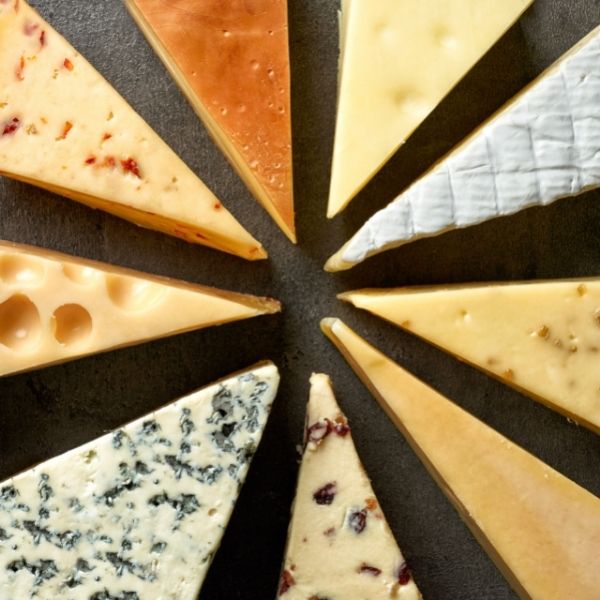 Different slices of cheese surrounding each other.