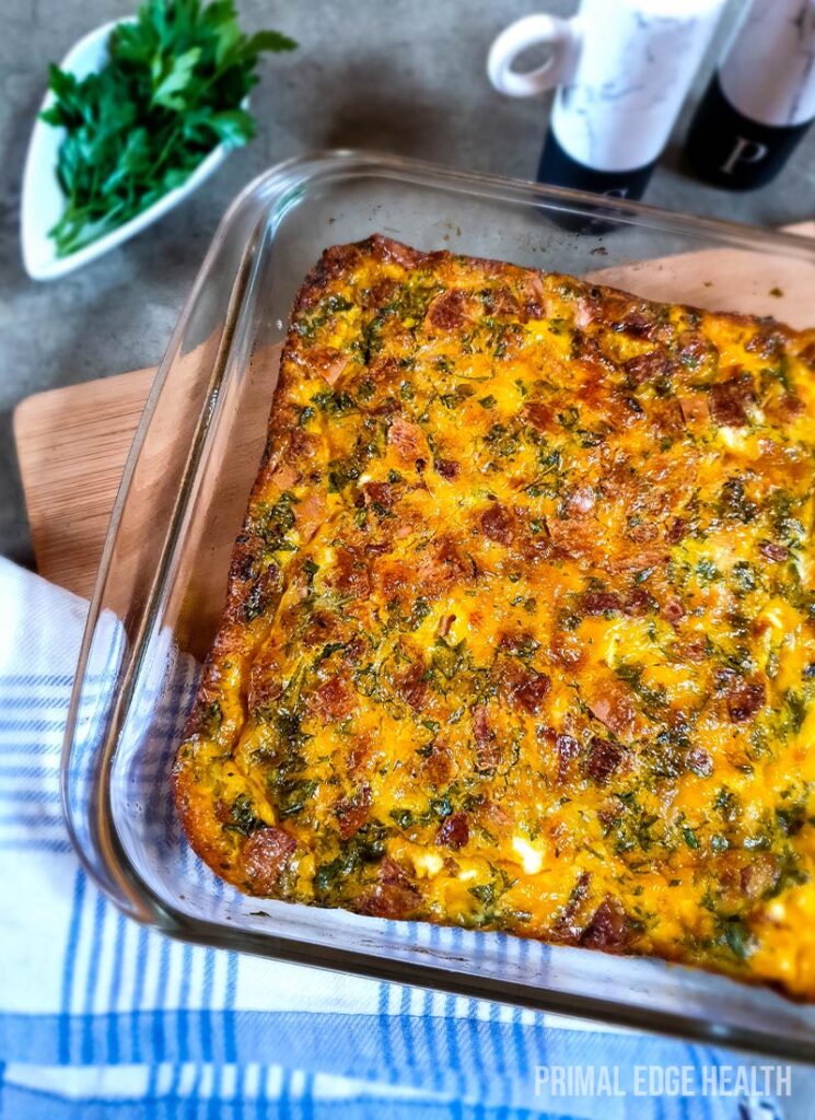 A dish of baked omelette with a blue cloth under it.