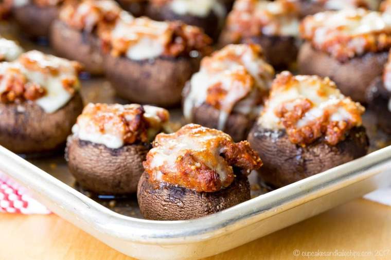 A batch of bolognese stuffed mushrooms appetizer on a tray.