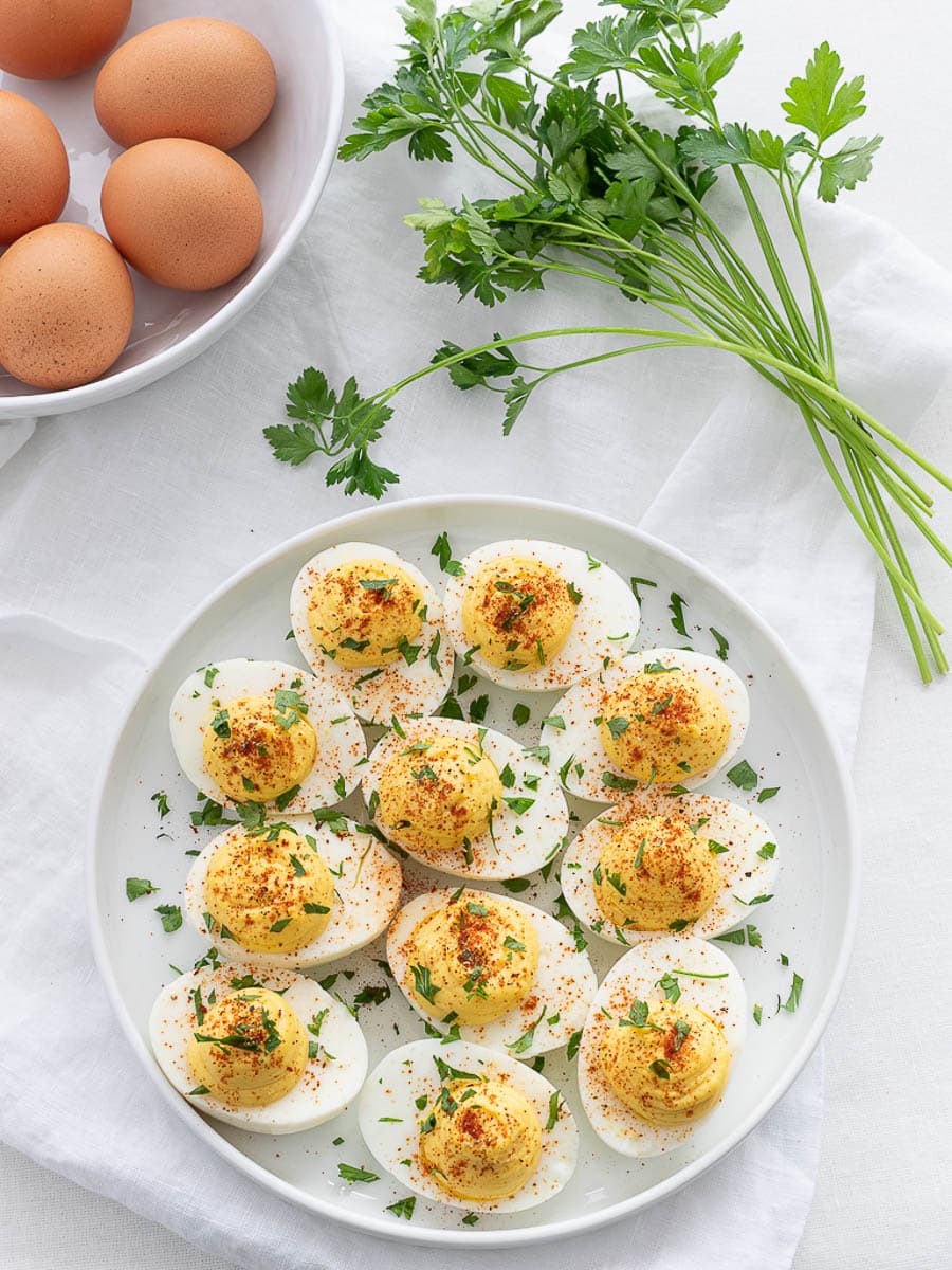 Classic keto deviled eggs on a white plate.
