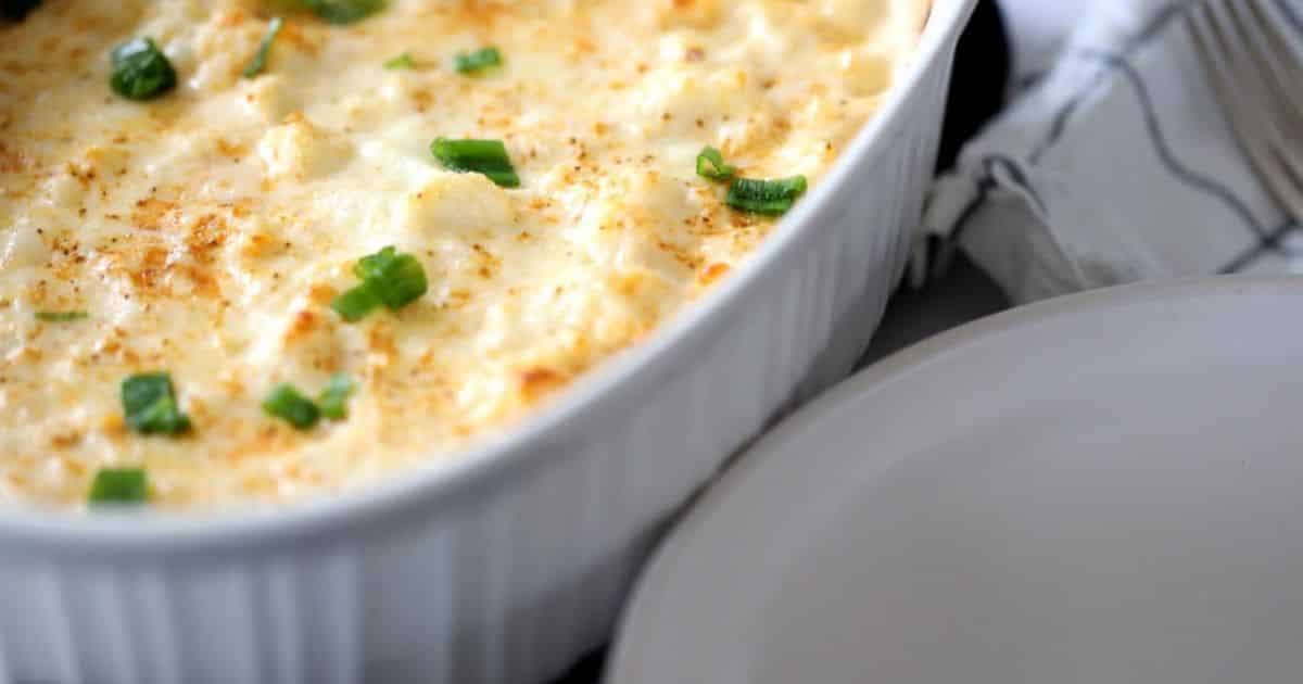 Crab mac and cheese in a white dish.