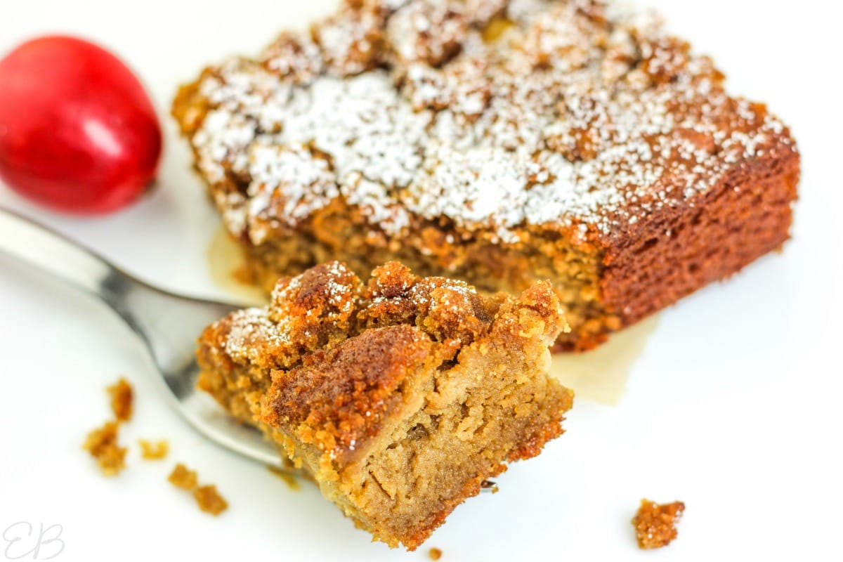 Keto apple cake with a fork taking a bite out of it.