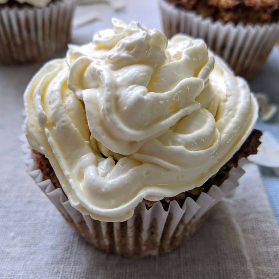 Keto zucchini cupcakes on a white surface.