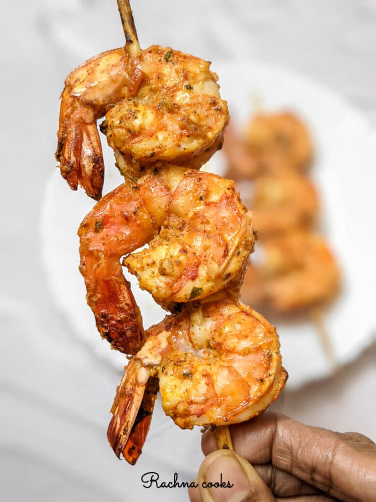 Tandoori tiger prawns on a stick.