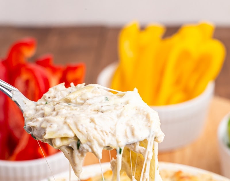 A spoonful of cheesy crab dip.