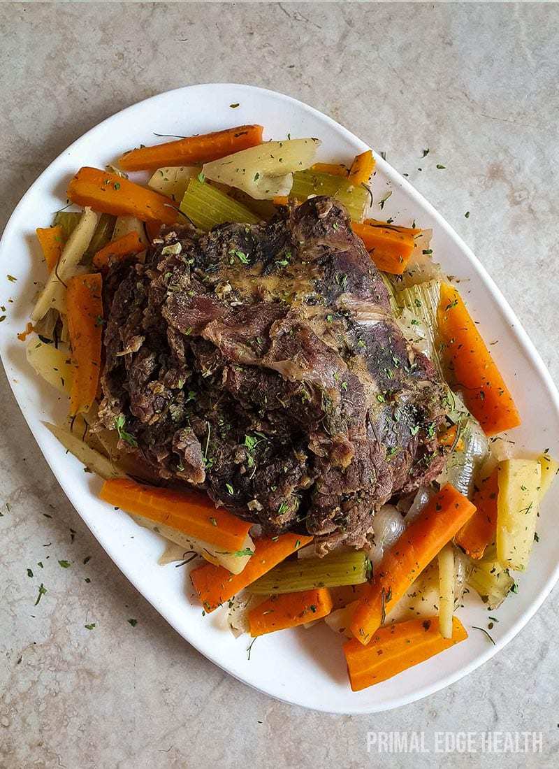 Keto post roast recipe on a white dish on a marble surface.