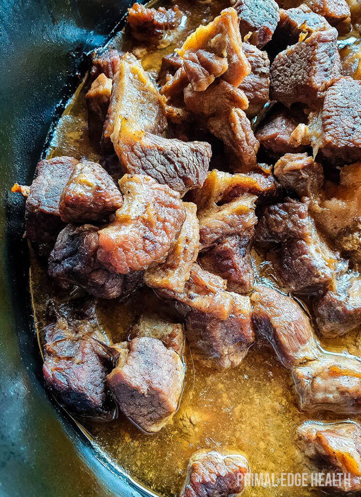 Carnivore beef stew in a black pot.