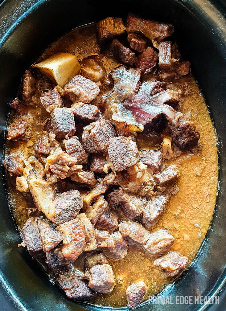 Carnivore beef stew in an oval black pot.