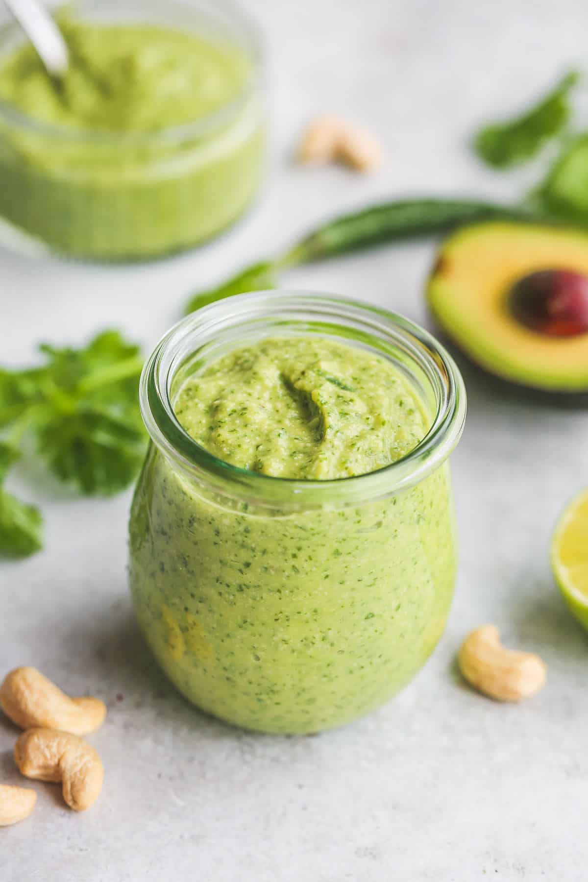 A glass of avocado cilantro dressing.