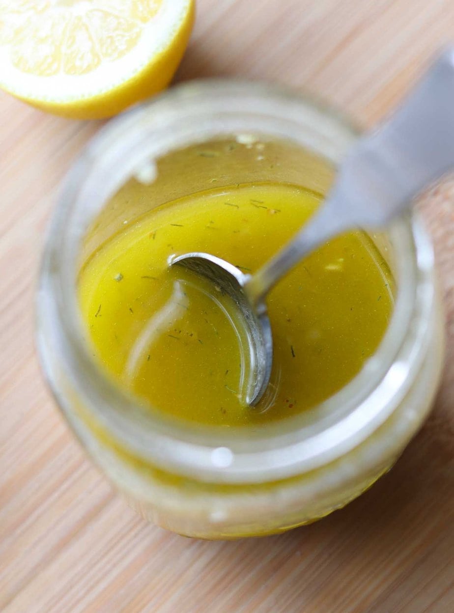 Easy Greek dressing in a small clear jar.