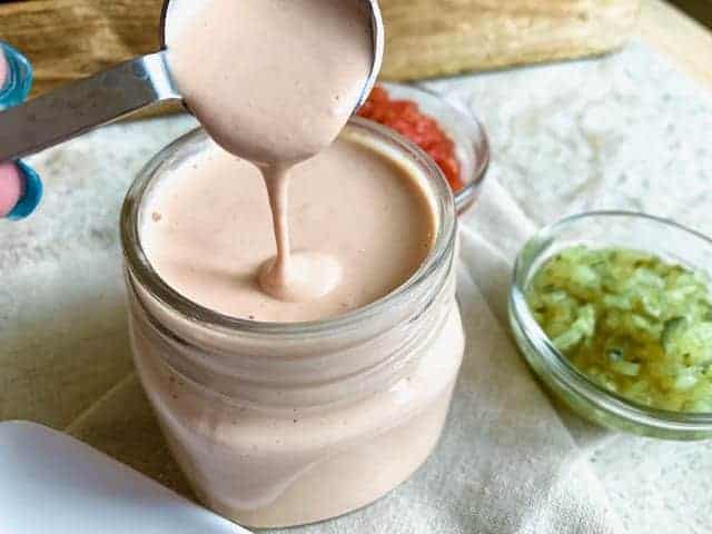 Thousand island dressing in a glass jar.