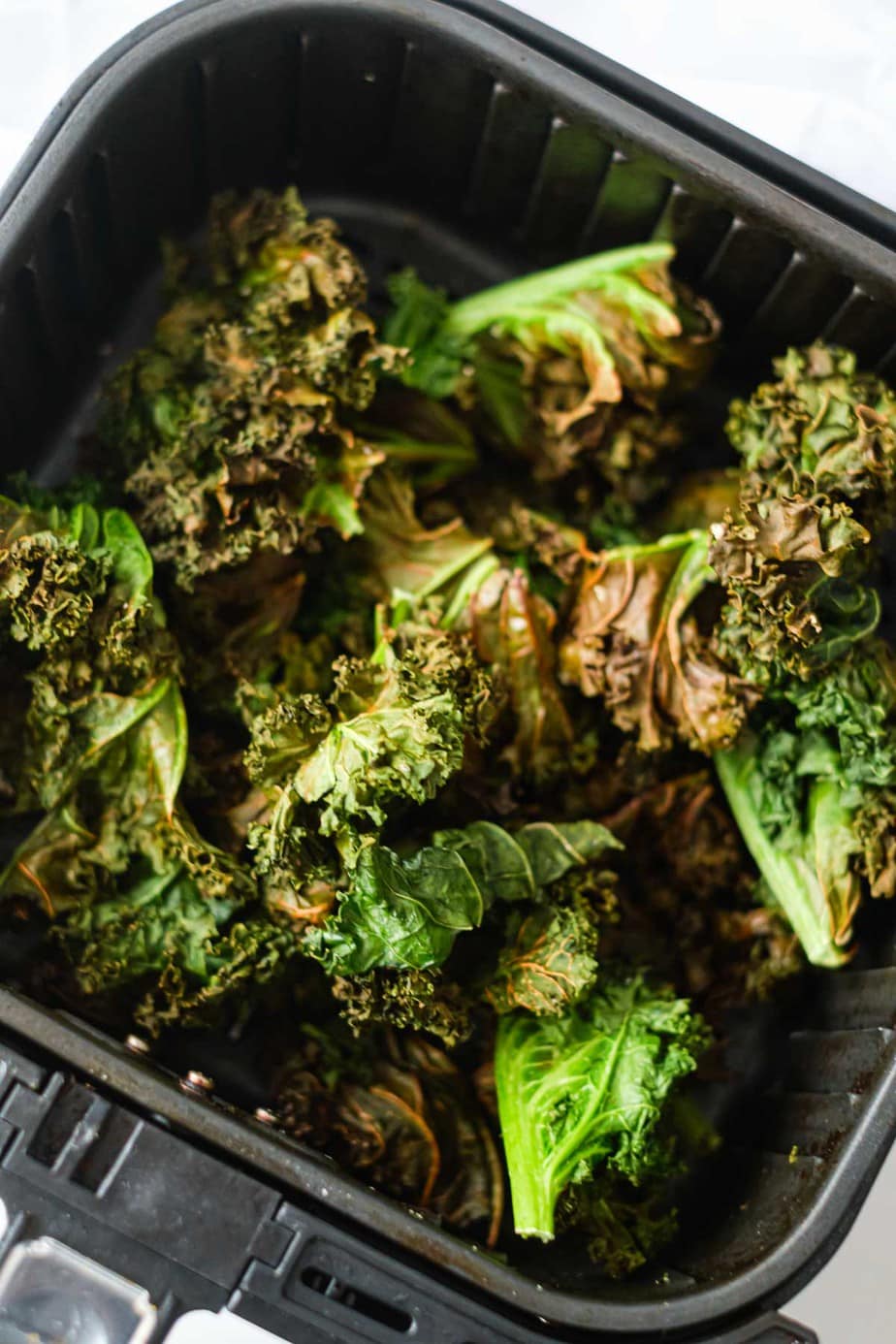 Kale chips in an air fryer.