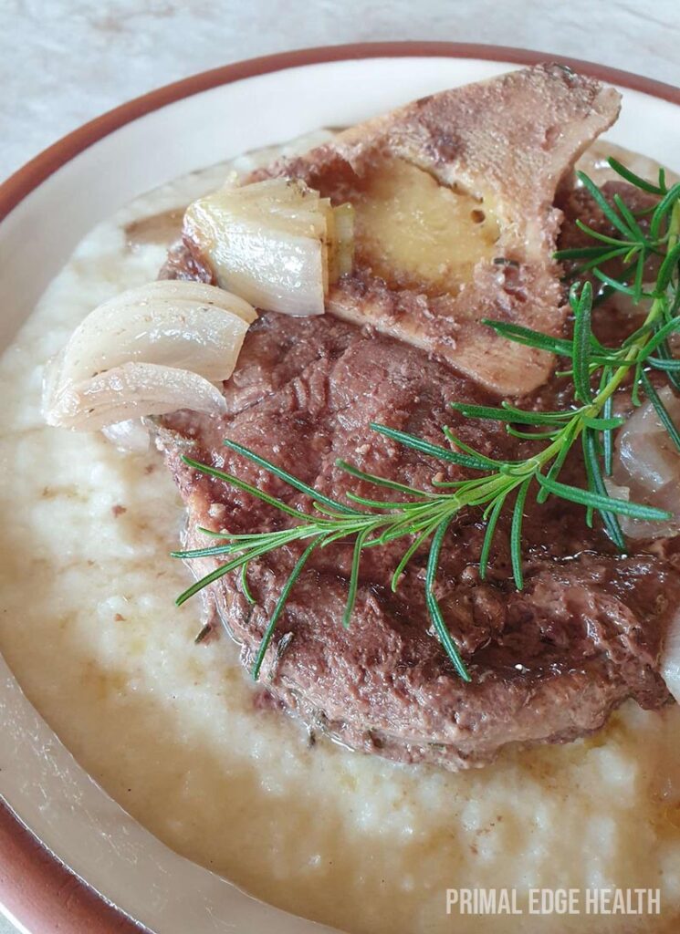 Beef shank slow cooker recipe served in a bowl on a white surface.