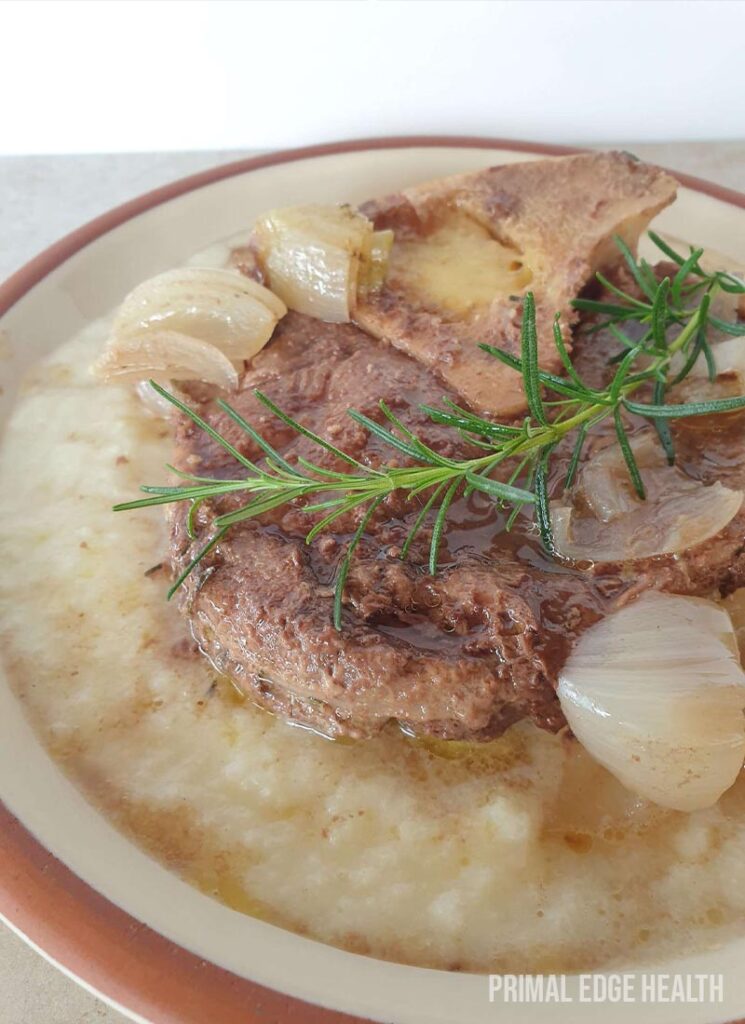 Beef shank slow cooker in a bowl with garnish.